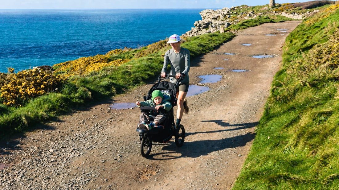 Julia Davis Buggy Running with an Out 'n' About Nipper V6 Plus on a coastal path with her son