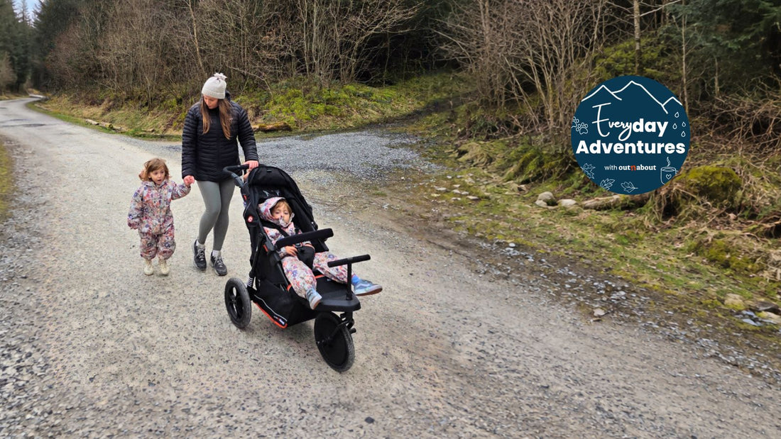 Parent pushing a Nipper Single V6 and holding a child’s hand on a woodland path, with Everyday Adventures icon.